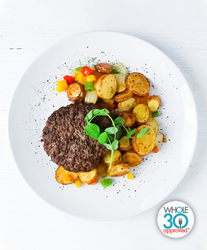 A plate of a Beef Burger with Fingerling Potato Hash