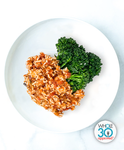 A plate of Chicken And Turkey Bolognese with Garlicky Broccolini