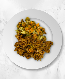 A plate of Chicken Tinga with Spaghetti Squash, Sweet Potato, Salsa Verde