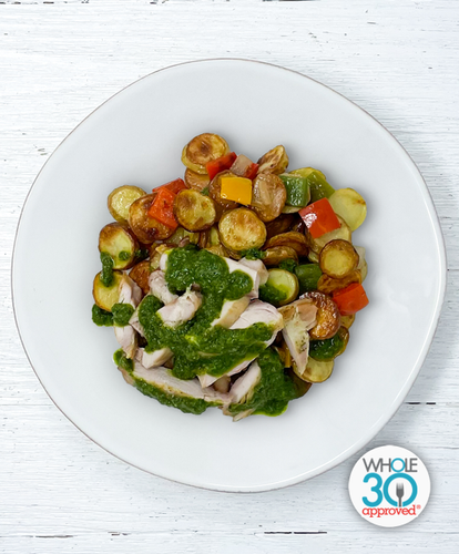 A plate of Chimichurri Chicken Thighs with Fingerling Potato Hash