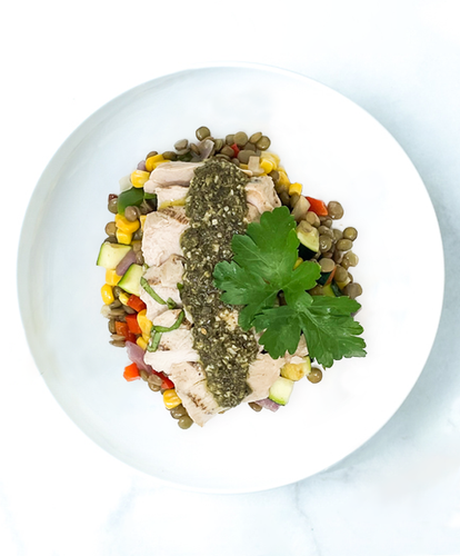 A plate of Lemon Basil Chicken With Corn & Lentil Fricassee