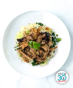 A plate of Smoked Carolina BBQ Pork With Vegetable Dirty Rice