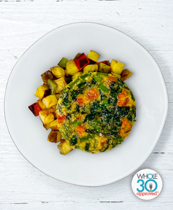 A plate of Tomato, Asparagus, and Spinach Frittata with Yukon Potato Hash