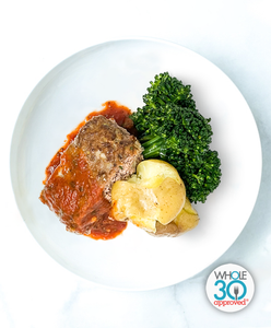 A plate of Venison Meatloaf With Garlicky Broccolini and Smashed Potatoes