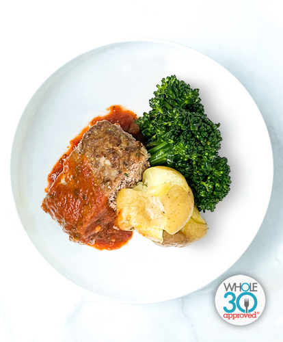 A plate of Venison Meatloaf With Garlicky Broccolini and Smashed Potatoes